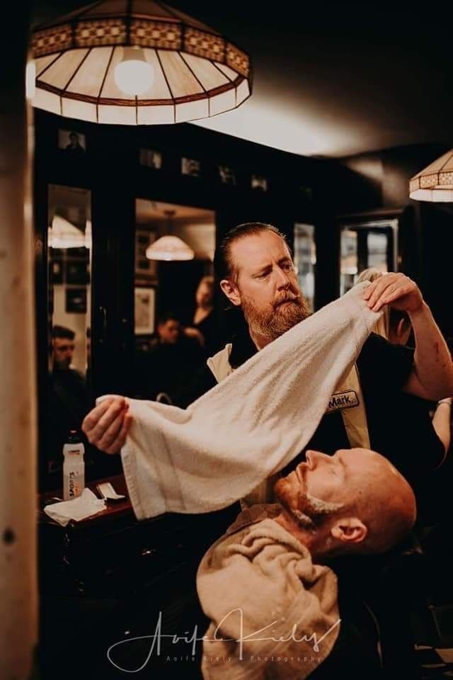 Mark at Marble City Barbers, Kilkenny, giving a hot towel shave in the shop