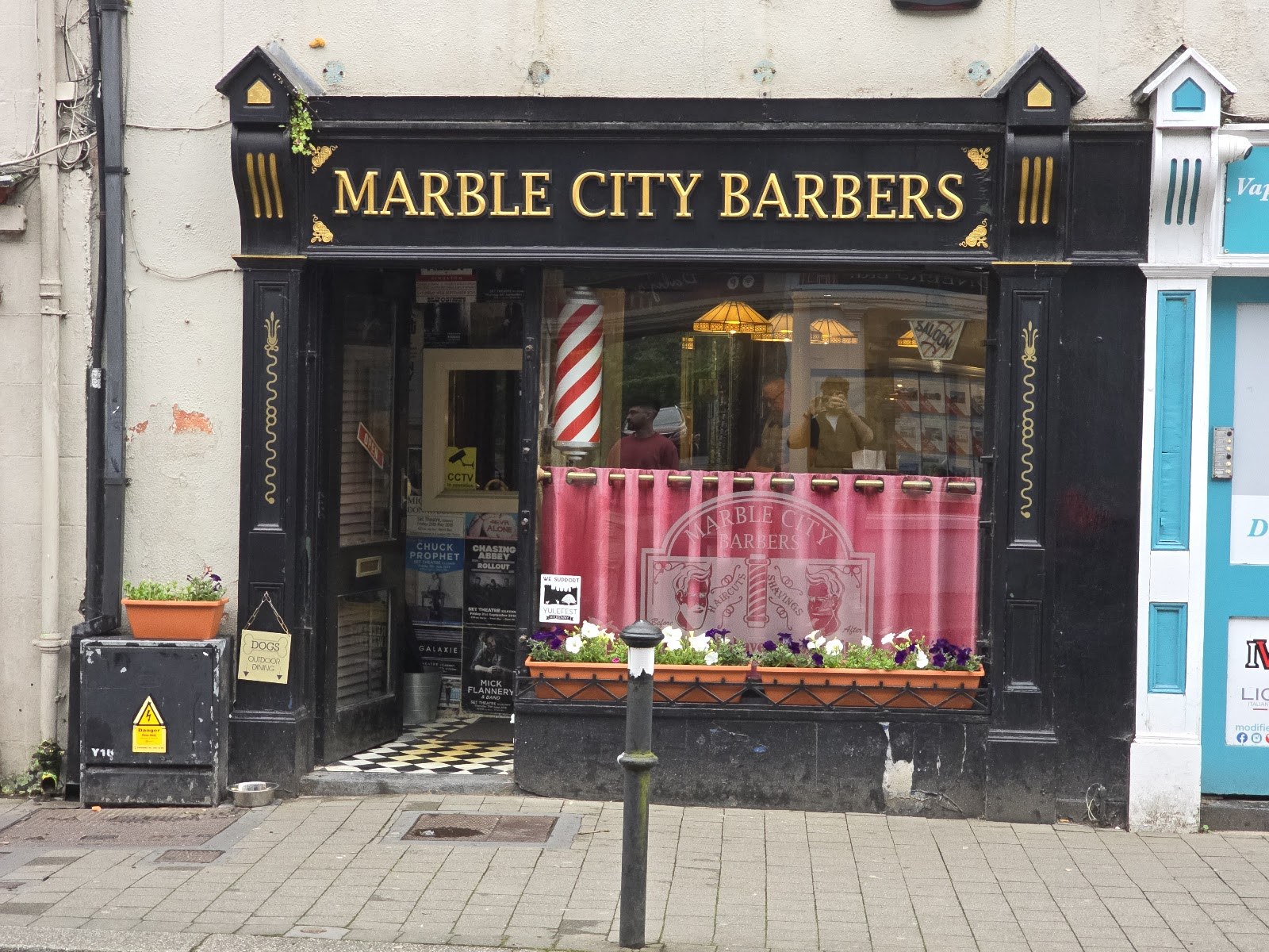 The Marble City Barbers shopfront on John Street Lower, Kilkenny, with gold lettering and a barber pole